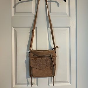 Light brown, tan crossbody purse. Medium to smaller size purse.